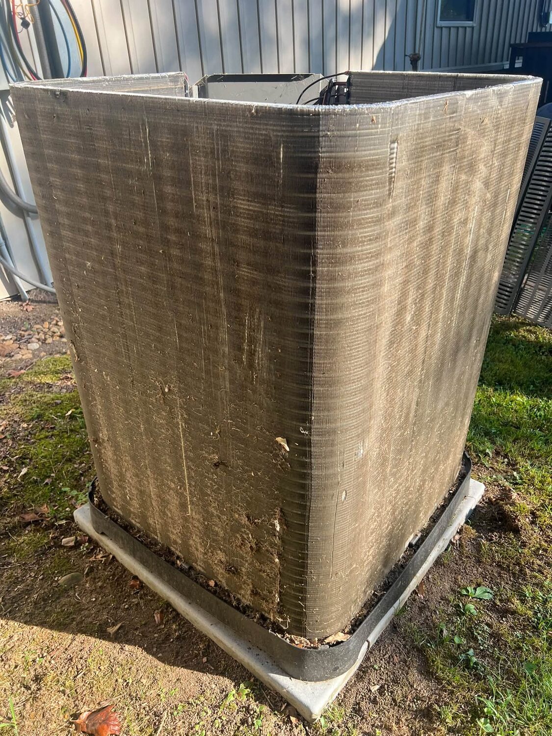 Dirty, clogged outdoor AC condenser coil before cleaning