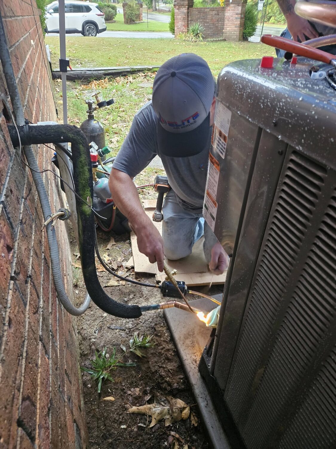 Elite Air technician checking the electrical at an indoor unit